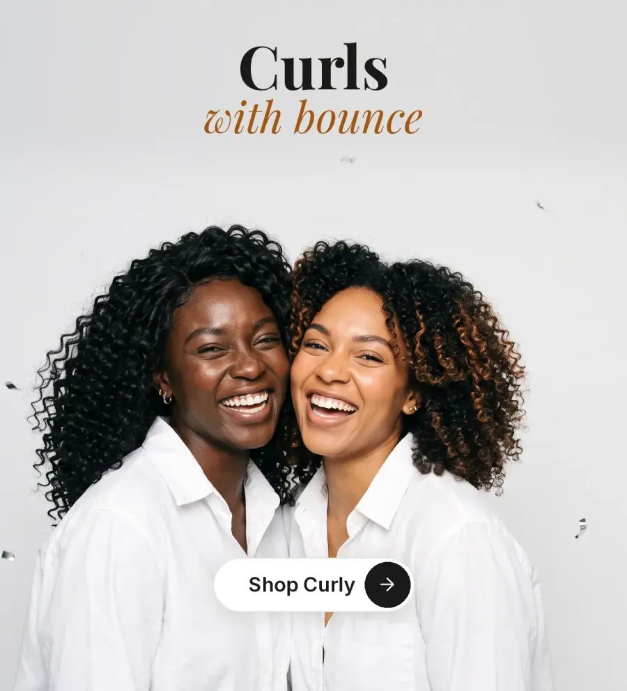 Two friends laughing in voluminous curly wigs. Curls with bounce. Shop Curly.